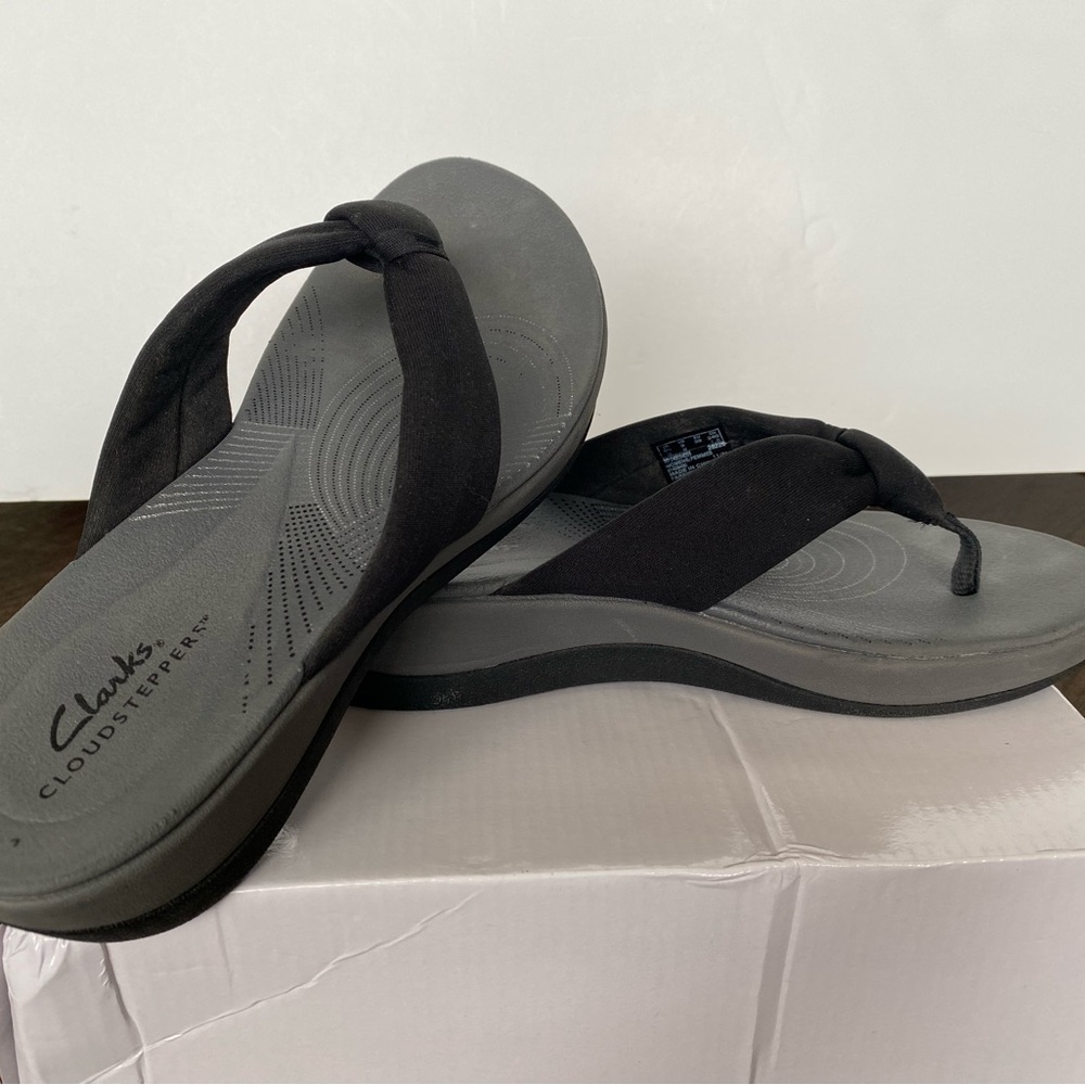 Ladies Clark brand black flip-flops with wedge heel size 8
